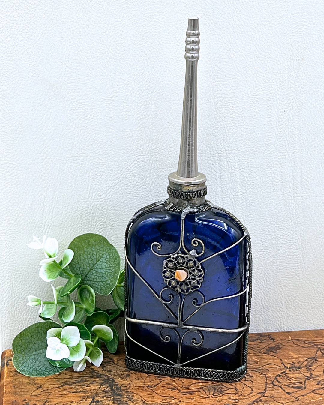 Blue Glass Perfume Bottle with Ornate Silver Design