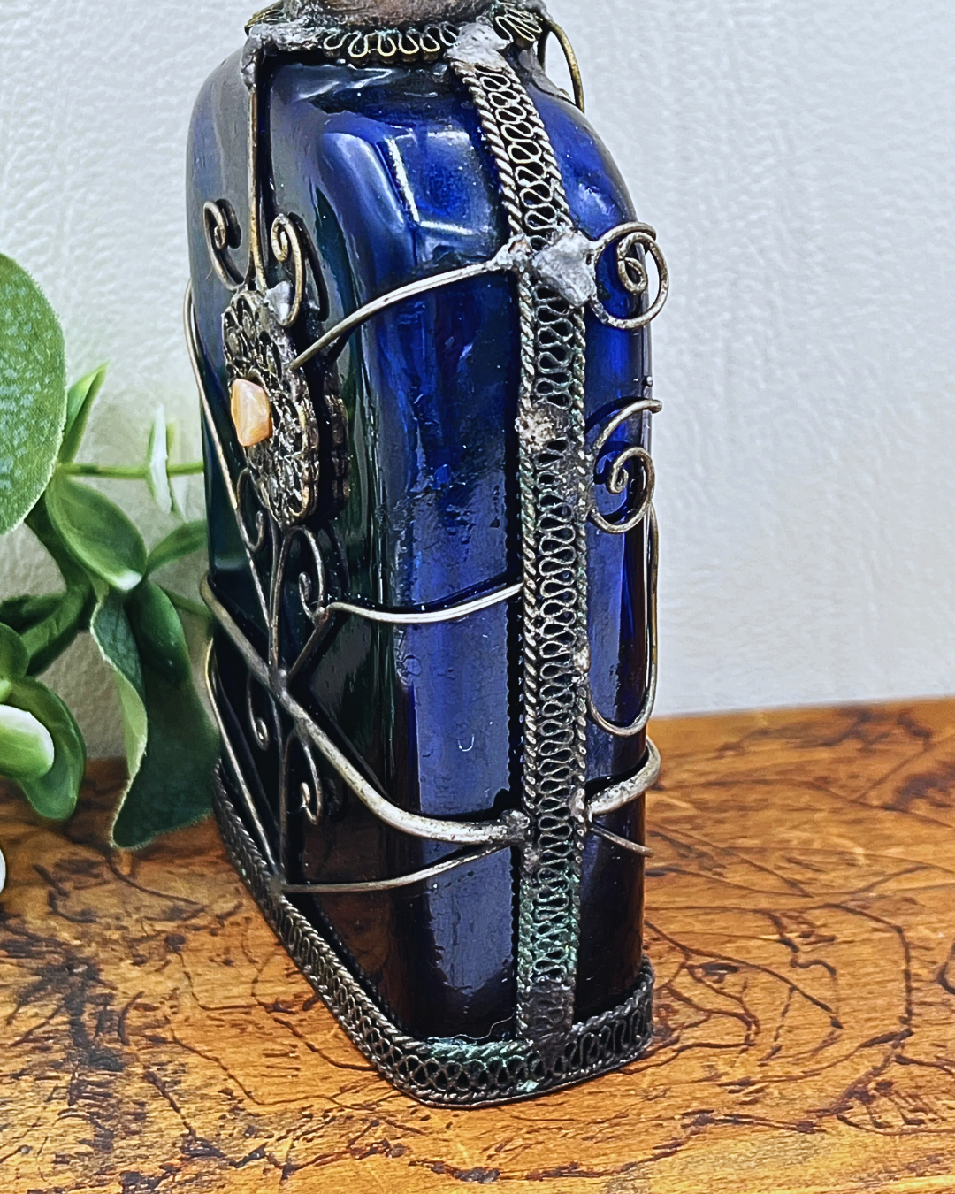 Blue Glass Perfume Bottle with Ornate Silver Design