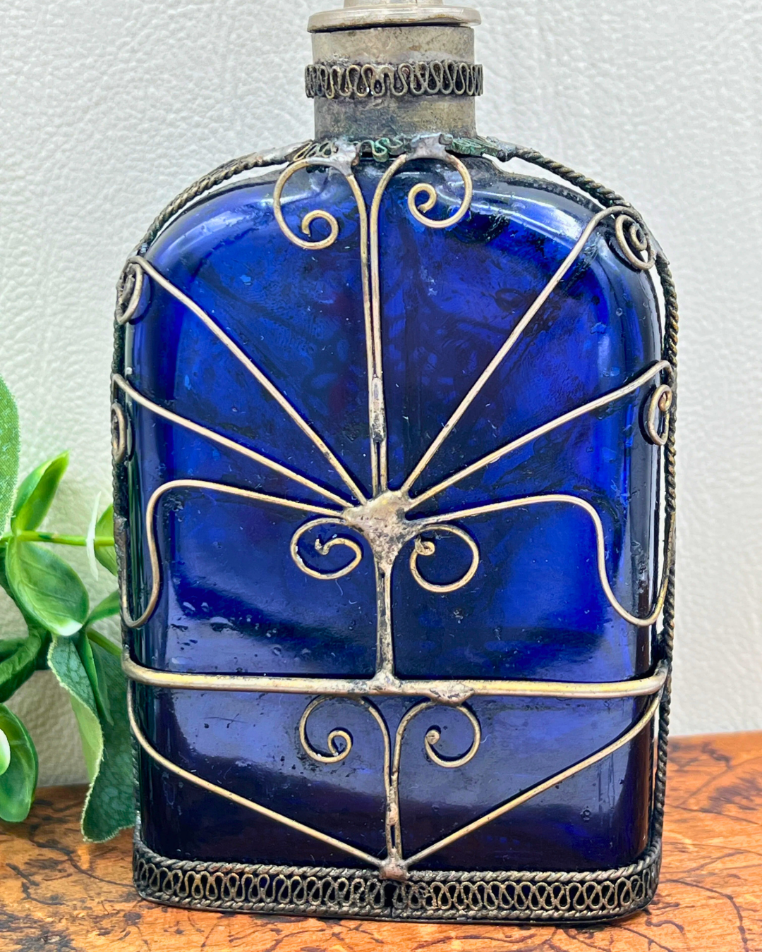 Blue Glass Perfume Bottle with Ornate Silver Design