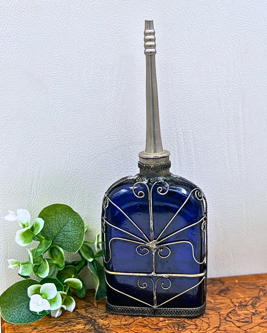 Blue Glass Perfume Bottle with Ornate Silver Design