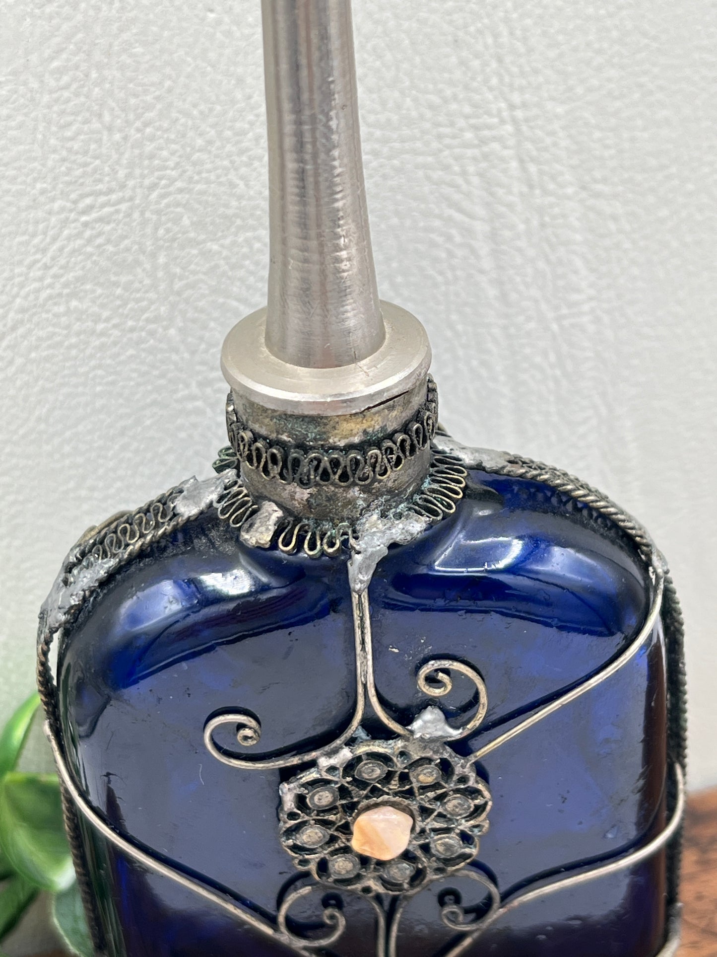 Blue Glass Perfume Bottle with Ornate Silver Design