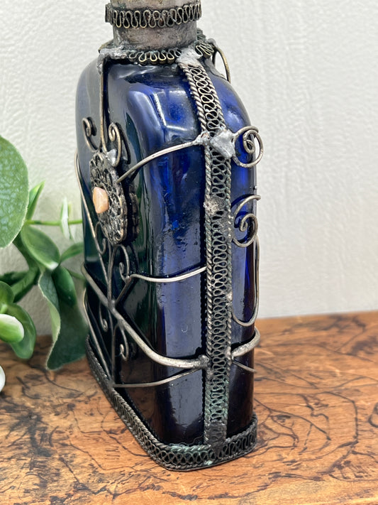 Blue Glass Perfume Bottle with Ornate Silver Design